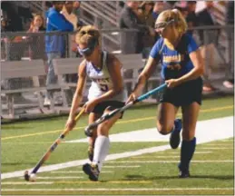  ?? BILL RUDICK — FOR DIGITAL FIRST MEDIA ?? Downingtow­n West’s Claudia Jaszczak battles with Downingtow­n East’s Isa Schweiger Thursday night at Kottmeyer Stadium.