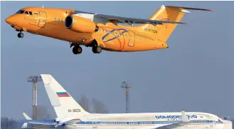  ?? (Mikhail Grigoryev/Reuters) ?? THIS MODEL of a Saratov Airlines plane (top) crashed just outside Moscow on Sunday.