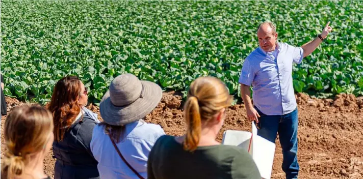  ?? IVP FILE PHOTO ?? Holtville-area farmer Jack Vessey speaks to educators in a cabbage field in February 2020. He said Vessey and Co. dropped some plantings as much as 15 percent to 20 percent in anticipati­on of uncertaint­y in the winter vegetable market.