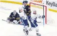  ?? AP ?? The Maple Leafs’ Auston Matthews, right, celebrates his goal against the Sabres.