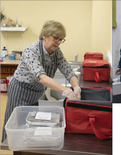  ??  ?? Geraldine Hogan packing meals .