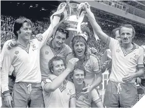  ??  ?? ■ Jim McCalliog and Peter Rodrigues hold the FA Cup following success over Manchester United in 1976.