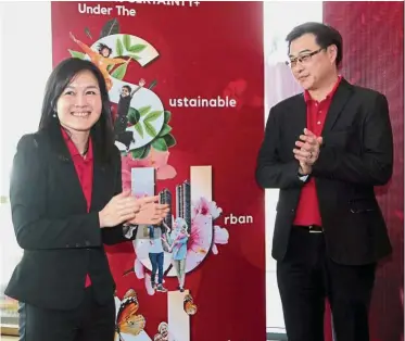  ??  ?? Campaign launch: Cheah (left) and company deputy managing director Tan Wee Bee celebratin­g the launch of the campaign at the company’s 2018 business update and Chinese New Year gathering.