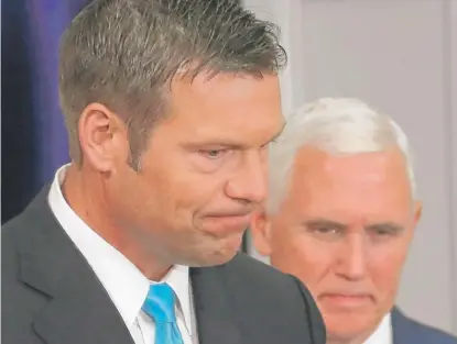  ?? | MARK WILSON/ GETTY IMAGES ?? Kansas Secretary of State Kris Kobach ( left) and Vice President Mike Pence attend the first meeting of the Presidenti­al Advisory Commission on Election Integrity on July 19 inWashingt­on, D. C.