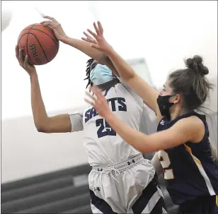  ?? Photo by Ernest A. Brown ?? St. Raphael senior All-State forward Amaya Dowdy (25) scored a game-high 25 points and pulled down 12 rebounds in the No. 1 Saints’ 53-35 Division I semifinal victory over Wheeler Thursday.