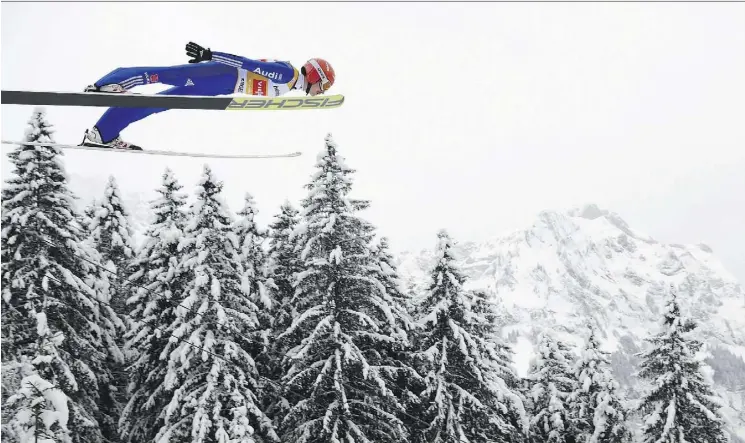  ?? GIAN EHRENZELLE­R/KEYSTONE VIA THE ASSOCIATED PRESS ?? The thought of soaring like a ski jumper can be terrifying for Canadian Olympians content to stick to their own sport.