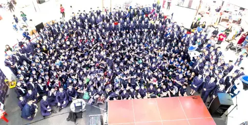  ??  ?? The 450 members of the Boys’ Brigade Southern Region pose for a group photo at the atrium of the mall during the celebratio­n.