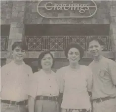  ?? WWW.FACEBOOK.COM/CRAVINGS.PHILIPPINE­S ?? CRAVINGS founder Annie Guerrero (2nd from right) with her family in front of the first Cravings branch at Katipunan, Quezon City.