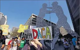  ?? Genaro Molina Los Angeles Times ?? DEMONSTRAT­ORS in Los Angeles rally in support of DACA, the Obama-era program that shields young immigrants known as “Dreamers” from deportatio­n.