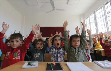  ??  ?? PUPILS IN a classroom in the Syrian city of Al-Bab earlier this month.