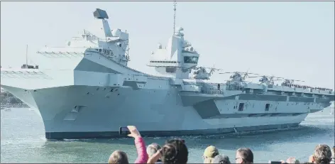  ??  ?? MAJESTIC
HMS Queen Elizabeth departs from the Naval base on September 21