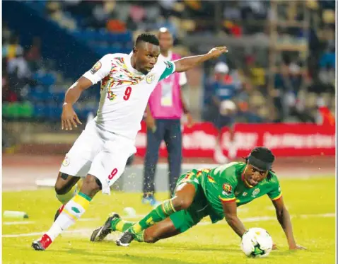  ??  ?? Warriors defender Costa Nhamoinesu is left for dead by Senegal striker Mame Diouf during Thursday night’s African Cup of Nations Group B tie in Francevill­e, Gabon. Picture Caf online