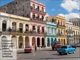  ??  ?? Havana’s streets are lined with grand, colourful colonial buildings