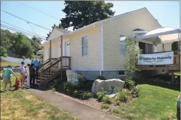  ??  ?? Kelly McCalliste­r, a member of the Habitat gives a tour of the new home.
for Humanity Constructi­on Committee,