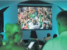  ?? Antonie Robertson / The National ?? Fans in the World Cup Tent at the Fairmont Hotel on The Palm, Dubai watch Saudi Arabia vs Russia