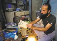  ?? Associated Press ?? People from more than 20 countries helped save the Amman bookstore owned by Hamzeh AlMaaytah.