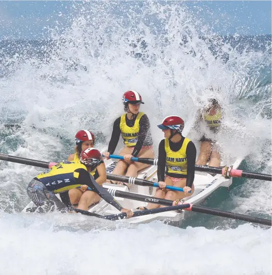  ?? Picture: MIKE BATTERHAM ?? Tallebudge­ra’s under-23 women’s crew battle the waves at Kurrawa.