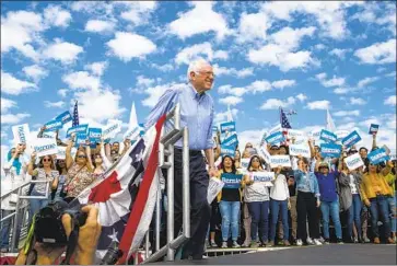  ?? Allen J. Schaben Los Angeles Times ?? SEN. BERNIE SANDERS, taking the stage at Valley High School in Santa Ana last week, appears to have won more than twice as much of the vote in the Nevada caucuses as did former Vice President Joe Biden.