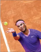  ?? — AFP photo ?? Nadal serves to Zverev during the Italian Open at Foro Italico in Rome, Italy.