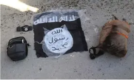  ?? Photograph: Syrian Democratic Forces/AP ?? A flag and bags belonging to IS fighters who were arrested by the Kurdish-led Syrian Democratic Forces after they attacked Ghuwayran prison, in Hasakah, north-east Syria.