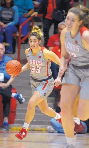  ?? GREG SORBER/JOURNAL ?? Lobos guard Jaedyn De La Cerda (23) brings the ball down the court during the Lobos’ exhibition victory over Colorado-Colorado Springs. She scored 18 points in the game.