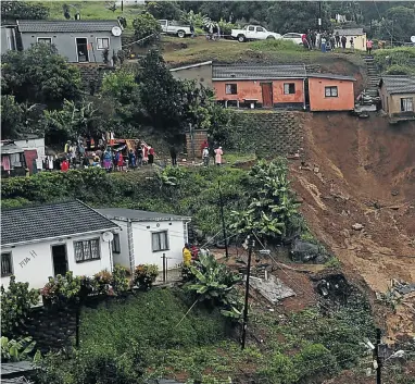  ??  ?? The remains of a house in Umlazi lie shattered in the mudslide that ripped it from the earth during this week’s heavy rain in Durban. Neighbouri­ng