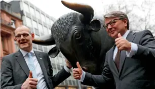  ?? — Reuters ?? Bernd Montag, CEO of Siemens Healthinee­rs and Theodor Weimer, CEO of German stock exchange Deutsche Boerse, pose outside the stock exchange after the official share trading start following an IPO at the trading floor of Frankfurt’s stock exchange.