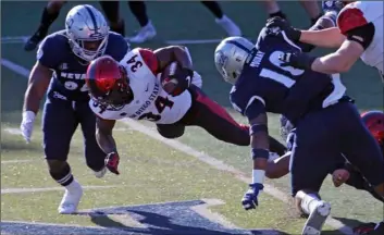  ?? AP Photo/Lance Iversen ?? San Diego State running back Greg Bell runs for a first down against Nevada during the first half of an NCAA college football game on Saturday, Reno, Nev.