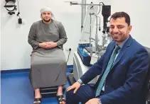  ?? ?? Mogemad Osama with Dr Esmaeil Arbabi at Moorfields Eye Hospital. Osama, an Ajman University student from Palestine, struggled for years with devastatin­g vision loss.