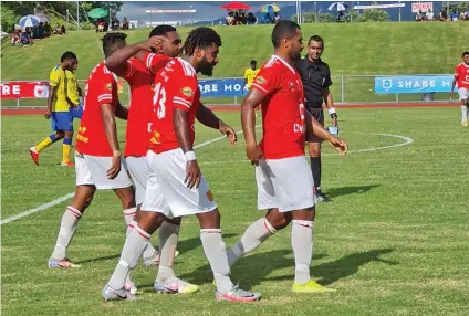  ?? Photo: Fiji FA Media ?? Rewa striker Samuela Nabenia (closest to camera) is congratula­ted by team-mates for scoring their second goal during the Digicel Premier League clash againat Nadroga at Churchill Park, Lautoka, on April 11, 2021.