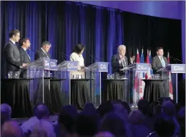  ?? The Canadian Press ?? Conservati­ve leadership hopeful Jean Charest, second right, speaks as Pierre Poilievre, left to right, Patrick Brown, Scott Aitchison, Leslyn Lewis, and Roman Baber look on during the Conservati­ve Party of Canada French-language leadership debate in Laval, Quebec on May 25.