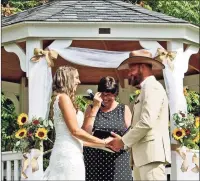  ?? Contribute­d photo ?? Mollie Hull and Kyle Hendrix exchange their wedding vows at Martin-Bishop Memorial Field in Guilford.