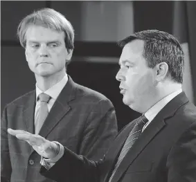  ?? SEAN KILPATRICK/ THE CANADIAN PRESS ?? Citizenshi­p and Immigratio­n Minister Chris Alexander, left, listens as Employment Minister Jason Kenney speaks in Ottawa on Friday about the Temporary Foreign Worker Program.