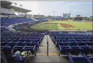  ?? ALFREDO ZUNIGA — THE ASSOCIATED PRESS ?? A man watches a profession­al baseball game between Boer de Managua and Flecheros de Matagalpa at Dennis Martinez stadium in Managua, Nicaragua on April 25.