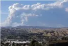  ??  ?? A plume of smoke from the Lake fire in Lake Hughes is seen from Santa Clarita, California, on Wednesday. Photograph: Myung J Chun/Los Angeles Times/Rex/Shut