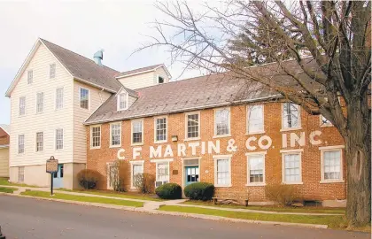  ?? CONTRIBUTE­D PHOTO/C.F. MARTIN & CO. ?? Guitar manufactur­er C.F. Martin &amp; Co.’s original factory in Nazareth has landed on the National Register of Historic Places, the company announced this week.