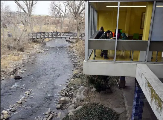  ?? CLIFF GRASSMICK — THE ASSOCIATED PRESS ?? Boulder Creek runs beside the Boulder Public Library on Dec. 13. The library is closed after tests showed levels of methamphet­amine in the exhaust vents of six restrooms.