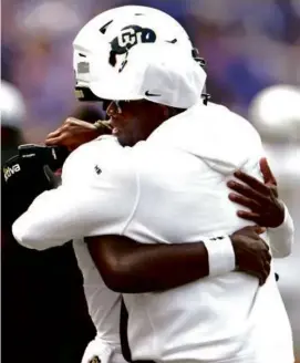  ?? RON JENKINS/GETTY IMAGES ?? Shedeur and Deion Sanders showed their big talk was no mere bluster as Colorado upset No. 17 TCU on the road.