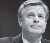  ?? CHIP SOMODEVILL­A Getty Images ?? Christophe­r Wray, FBI director appointed by President Trump, has not let politics intrude as he does his job. President Biden will keep him in the post.