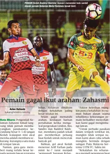  ??  ?? PEMAIN Kedah Baddrol Bakhtiar (kanan) menanduk bola sambil diasak pemain Kelantan Mohd Farisham Ismail (kiri).