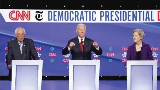  ?? AP ?? Democratic presidenti­al candidates (from left) Sen. Bernie Sanders, former Vice President Joe Biden and Sen. Elizabeth Warren participat­e in a debate on Tuesday in Westervill­e, Ohio.