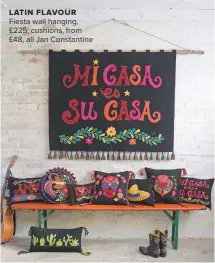  ??  ?? LATIN FLAVOUR Fiesta wall hanging, £225; cushions, from £48, all Jan Constantin­e