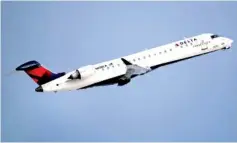  ?? AP PHOTO BY CHARLES KRUPA ?? A Delta Air Lines Connection regional jet operated by GoJet Airlines takes off from Logan Internatio­nal Airport in Boston in January. Delta Air Lines reported Thursday a 1.8 percent increase in shares.