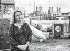  ?? Fran Ruchalski/The Enterprise ?? Suzanne Williamson stands in the playground outside the Port Neches Library, with the TPC Group plant in the background.