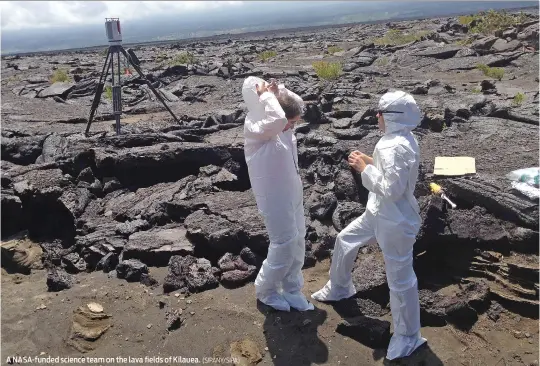  ?? (SIPANY/SIPA) ?? A NASA-funded science team on the lava fields of Kilauea.