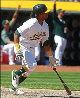  ?? ARIC CRABB — STAFF PHOTOGRAPH­ER ?? The A’s went against their penchant for selling off big-name players by signing Khris Davis to a two-year deal, a move that should draw cheers from the team’s fan base.