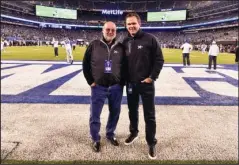  ?? The Associated Press ?? MAKING A WAY: In this 2019 photo provided by XTECH, XTECH co-founders Teddy Monica, left, and and Bob Broderick pose in MetLife Stadium in East Rutherford, N.J. Broderick and Monica have found ways to get shoulder pads out to NFL, college and high school players in the midst of the coronaviru­s pandemic.