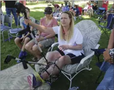  ??  ?? Melissa Cochran, who was injured in the March 22 London terror attack, and whose husband Kurt Cochran was killed, attends a memorial concert Saturday in Bountiful, Utah. AP PHOTO