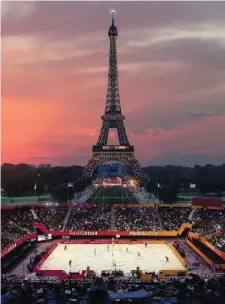  ??  ?? This computer-generated image provided by Paris 2024 shows the beach volleyball venue in front of the Eiffel Tower in Paris