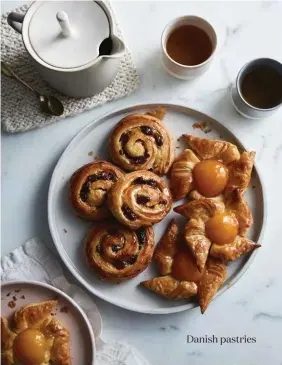  ??  ?? Danish pastries PASTRIES Phendei plate (main) and Basix linen napkin from The Design Hunter. Mat from Hale Mercantile Co. Studio Arhoj cups and Sue Ure teapot from Luumo. Side plate from Chuchu. STEPS House Doctor apron and saucepan (step 6), and...